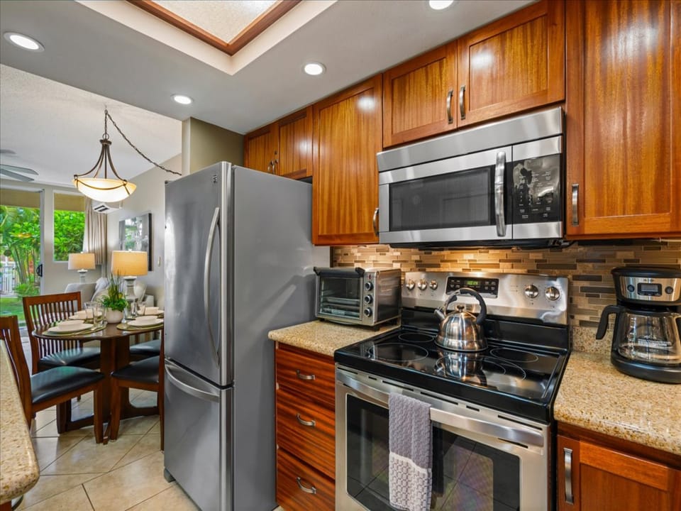 The fridge, microwave, and toaster oven make island living easy.