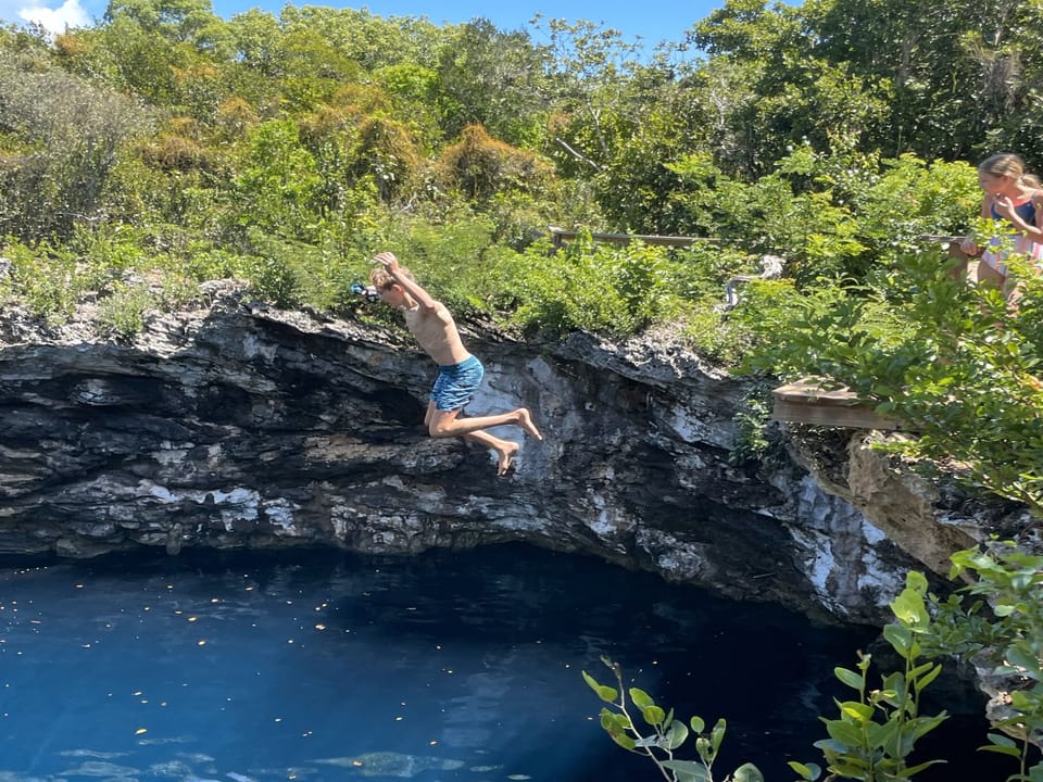Cliff jumping at Rock Sound Ocean hole, South Eleuthera.