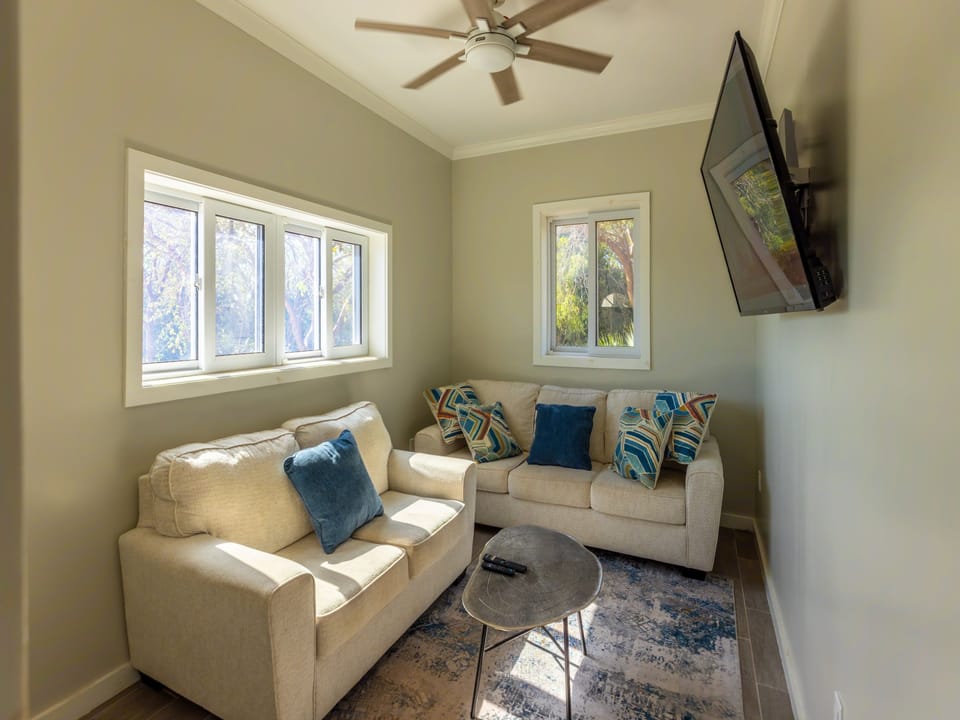 Living area with large 65-inch screen tv.
