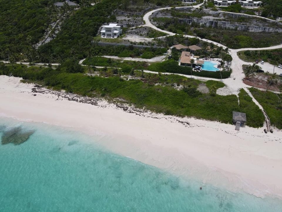 50-mile, 180-degree pink sand beach and ocean views.