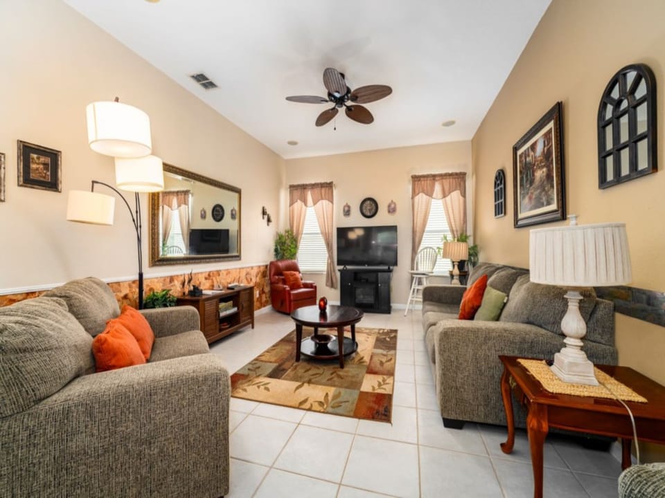 FAMILY ROOM:  55” Flat Screen TV, CD/DVD Player, DVD Library, Ceiling Fan, 1 Sofa, 1 Loveseat, 1 Chair and 1 Recliner