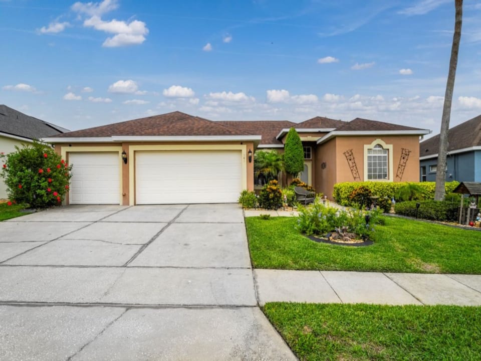 FRONT EXTERIOR:  4 Bedroom, 3 Bath Home with Driveway for 3 Vehicles
