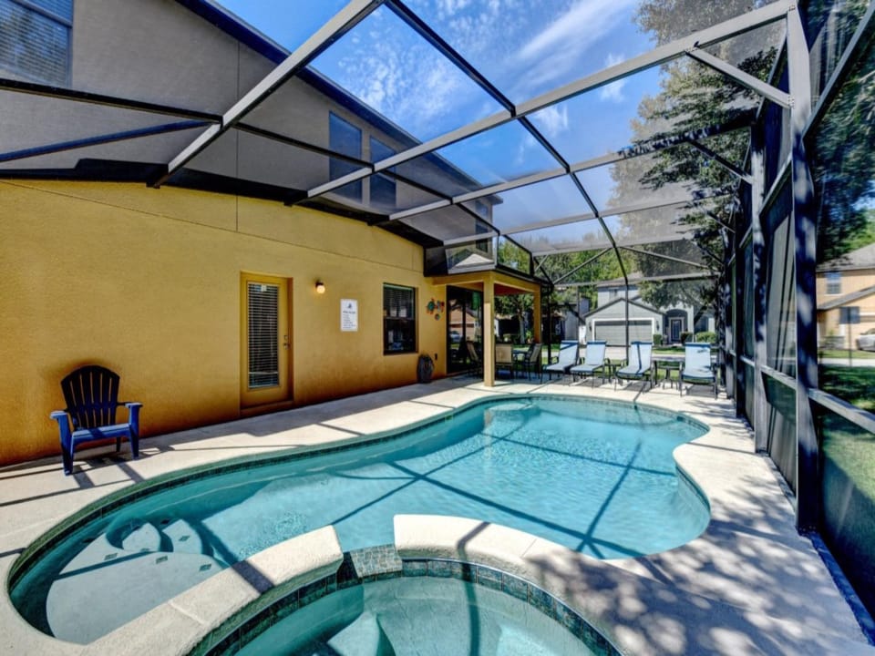 PATIO:  Private Screened North Facing Swimming Pool & Spa w/ 4 Chaise Lounges,  6-Seat Dining Table & 1 Adirondack Chair