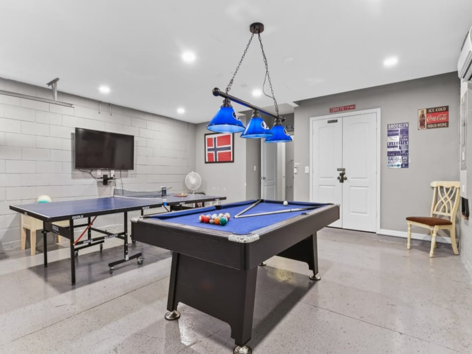 2-CAR GARAGE:  Game Room with Flat Screen TV, Pool Table, Ping Pong Table and Wall-Mounted Ductless Air Conditioner