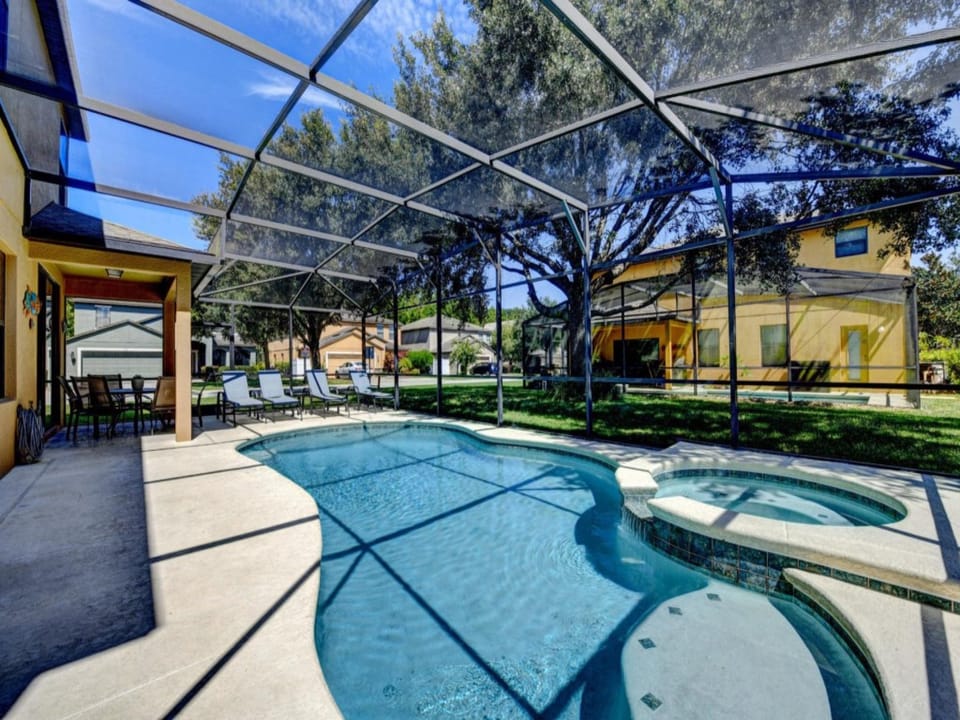 PATIO:  Private Screened North Facing Swimming Pool & Spa w/ 4 Chaise Lounges,  6-Seat Dining Table & 1 Adirondack Chair