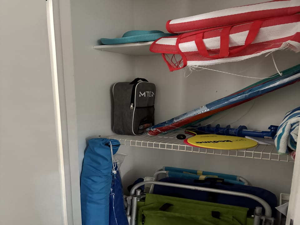 Paddles, Pickle, beach fun in front closet
