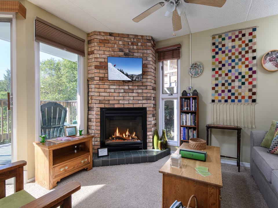 Bright and inviting living space with fireplace for warm, relaxing evenings