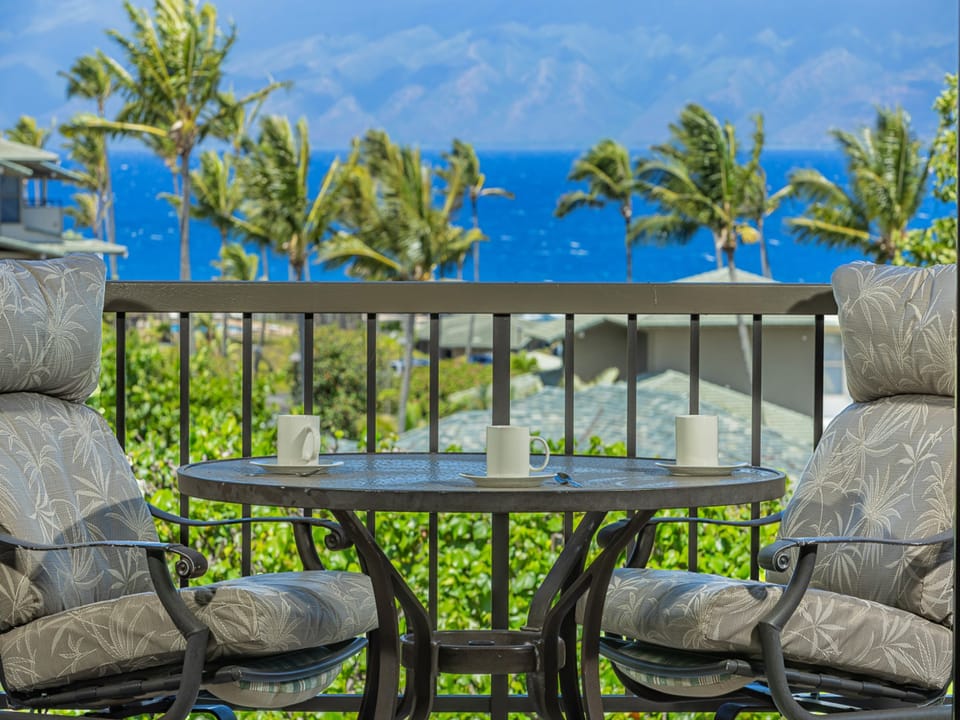 Morning coffee for two with Kapalua’s sparkling sea on the horizon