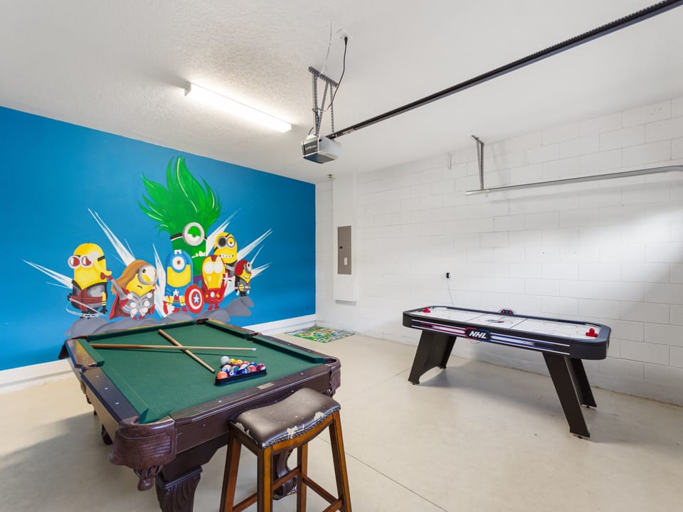 Games room with pool table and air hockey.