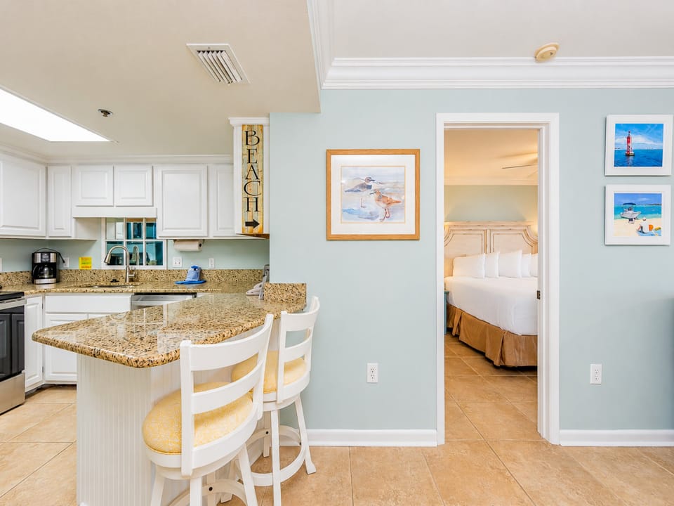 Enjoy cooking in this bright kitchen featuring stainless appliances and a cozy breakfast bar