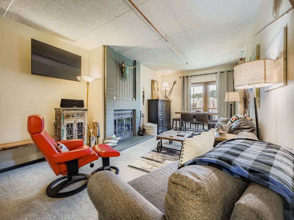 Bright and Open Living Room with a Cozy Fireplace.