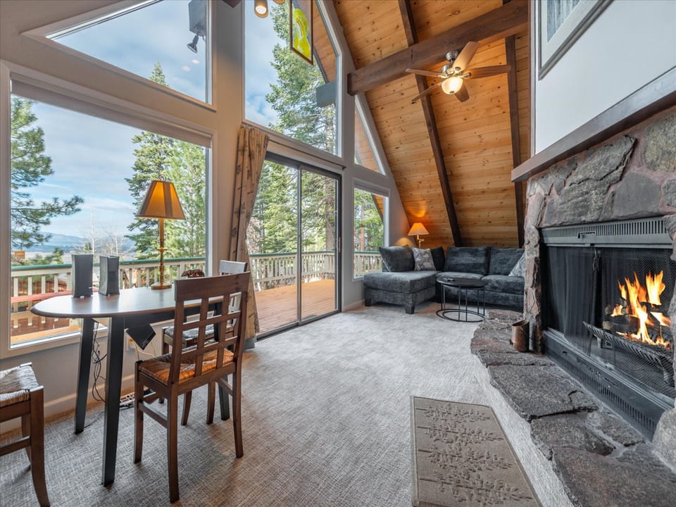 Warm up by the cozy wood burning fire place nestled perfectly between the couch and game table for everyone to enjoy.