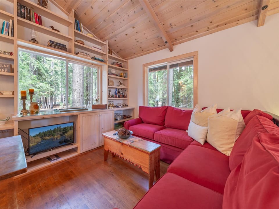 Feel at home in the second living area, complete with forest views, a built in bookshelf and smart TV, ready for you to stream your favorite shows.