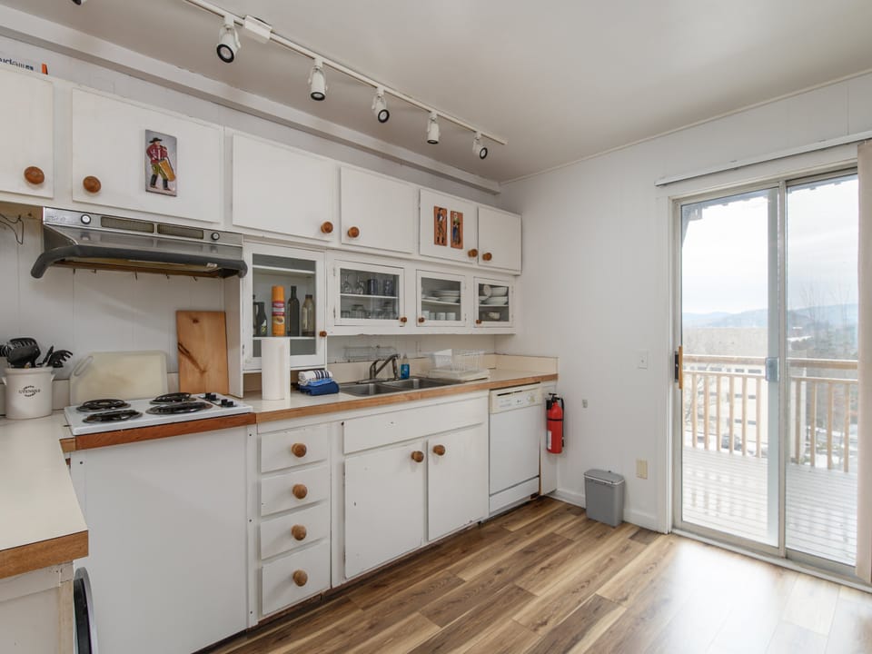 Your bright and sunny kitchen awaits with warm wood countertops and some of the essentials to create simple meals. Step outside to your private balcony and soak in the breathtaking views while your morning coffee brews.