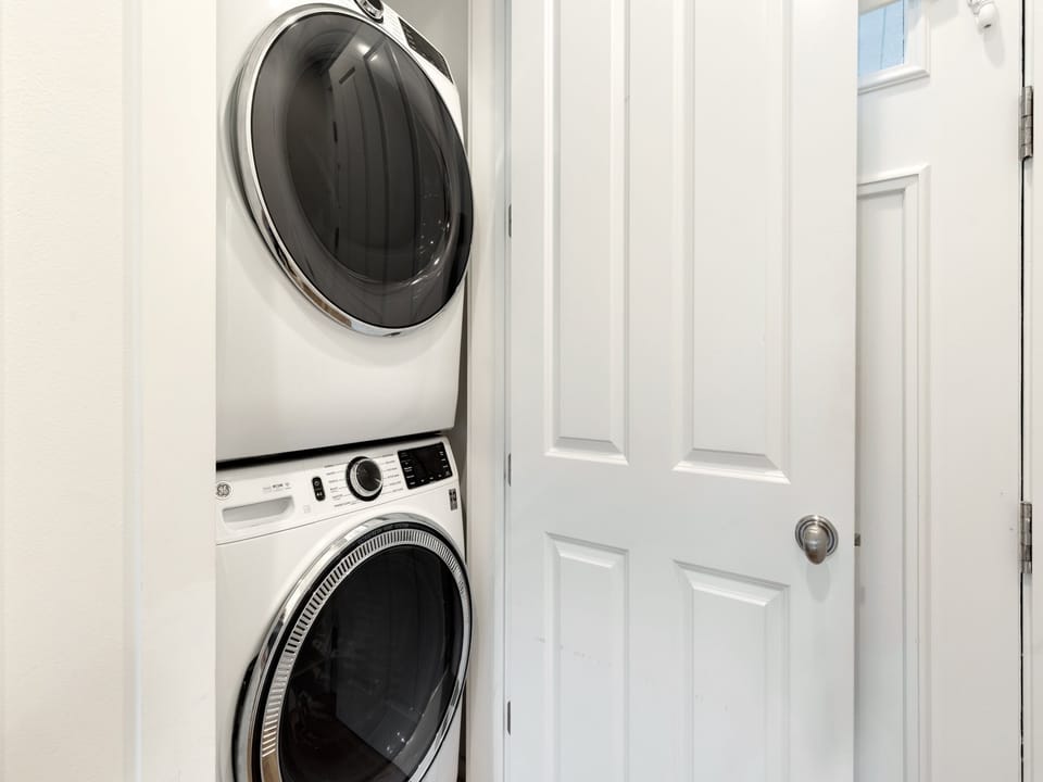 Your private laundry room features a convenient stacked washer and dryer, letting you pack light and refresh your wardrobe anytime during your stay.