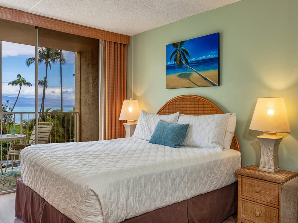 Wake to an oceanfront view framed by swaying palms. Your private lanai invites morning coffee while crisp linens and soft tropical hues surround you in island calm.