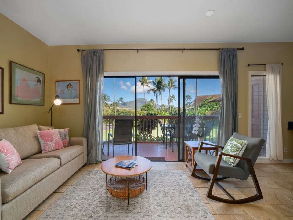 Settle into your tropical sanctuary where palm trees sway beyond your windows and comfortable furnishings invite relaxation.