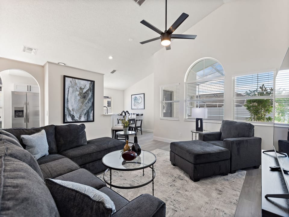 Modern living room with sectional sofa and accent chairs