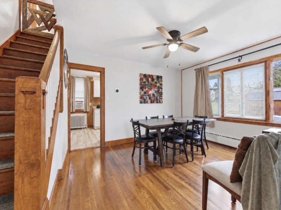 Built in the graceful mid-century era, this home features classic architectural touches and a clean, functional layout that feels both nostalgic and beautifully timeless. This stairway connects the upper and lower floors