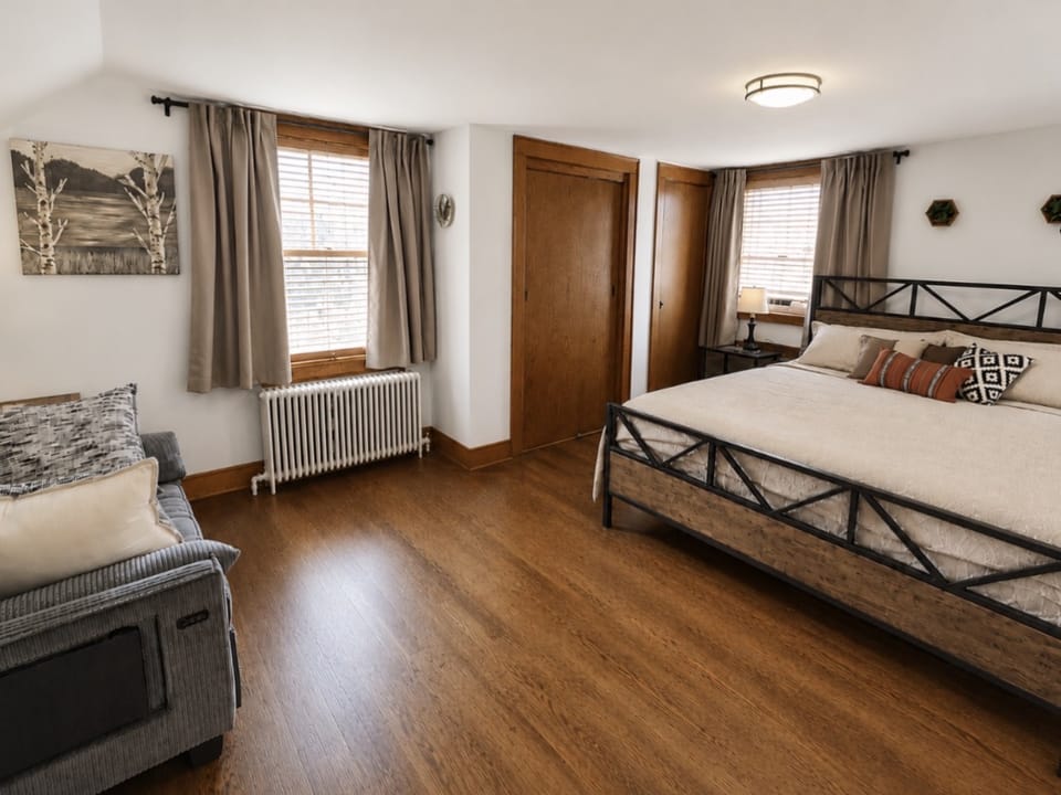 There's a ton of storage in this King bedroom, w/2 closets, custom built-in drawers, built-in cabinet cubby & nightstand tables with drawers. This spacious and inviting large bedroom has a convertible twin-sleeper.