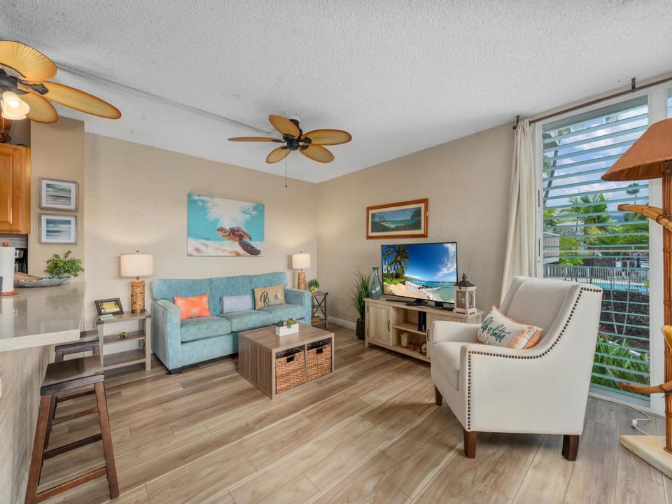 Ocean breezes flow through this open and inviting living room
