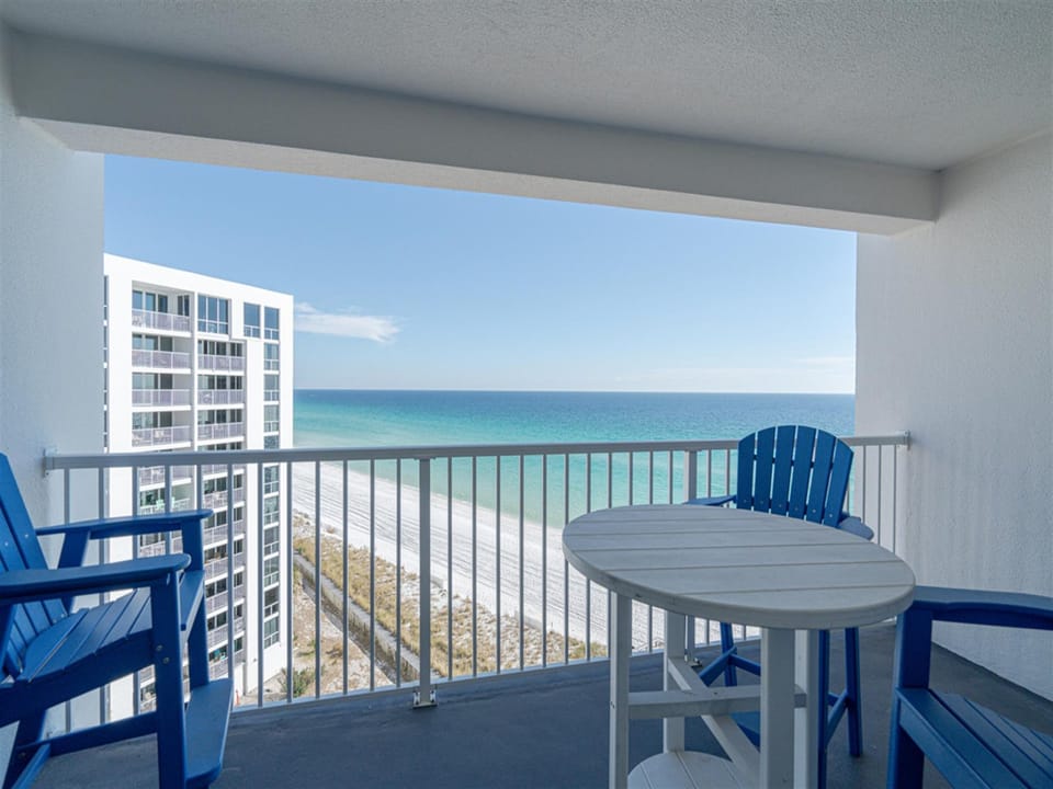 Your private balcony offers stunning ocean views where you can sip morning coffee while watching waves meet pristine white sand below.
