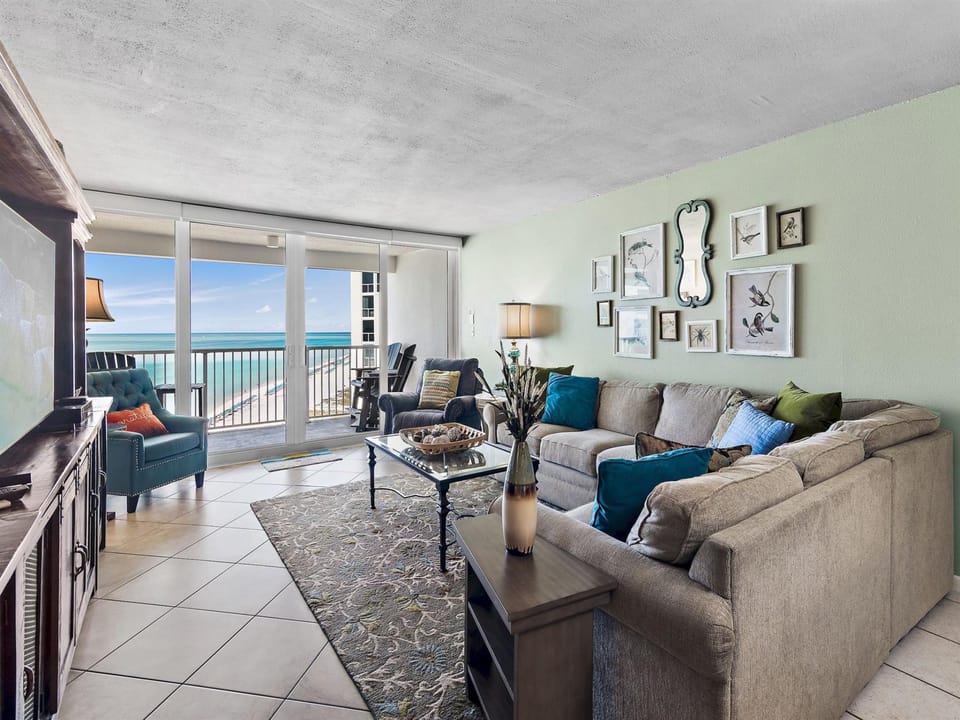 Relax in your spacious living room with plush seating and stunning ocean views right outside your door.