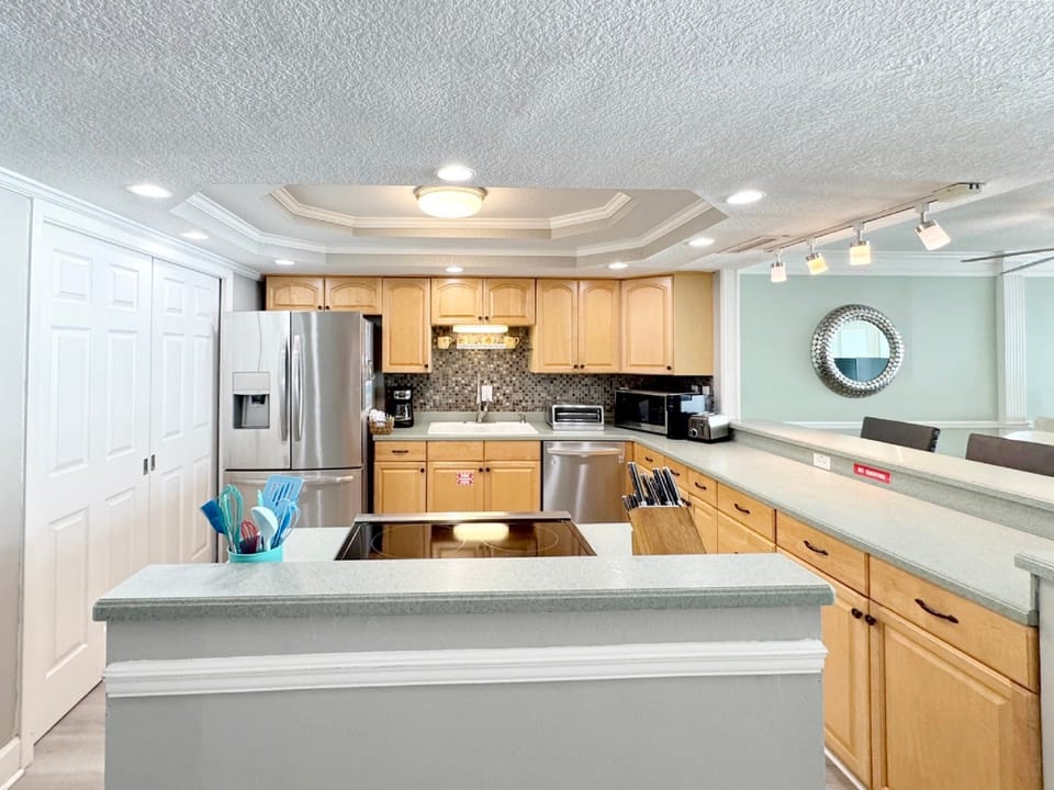 Your spacious kitchen features modern appliances, granite countertops, and an open island perfect for preparing meals and gathering together.