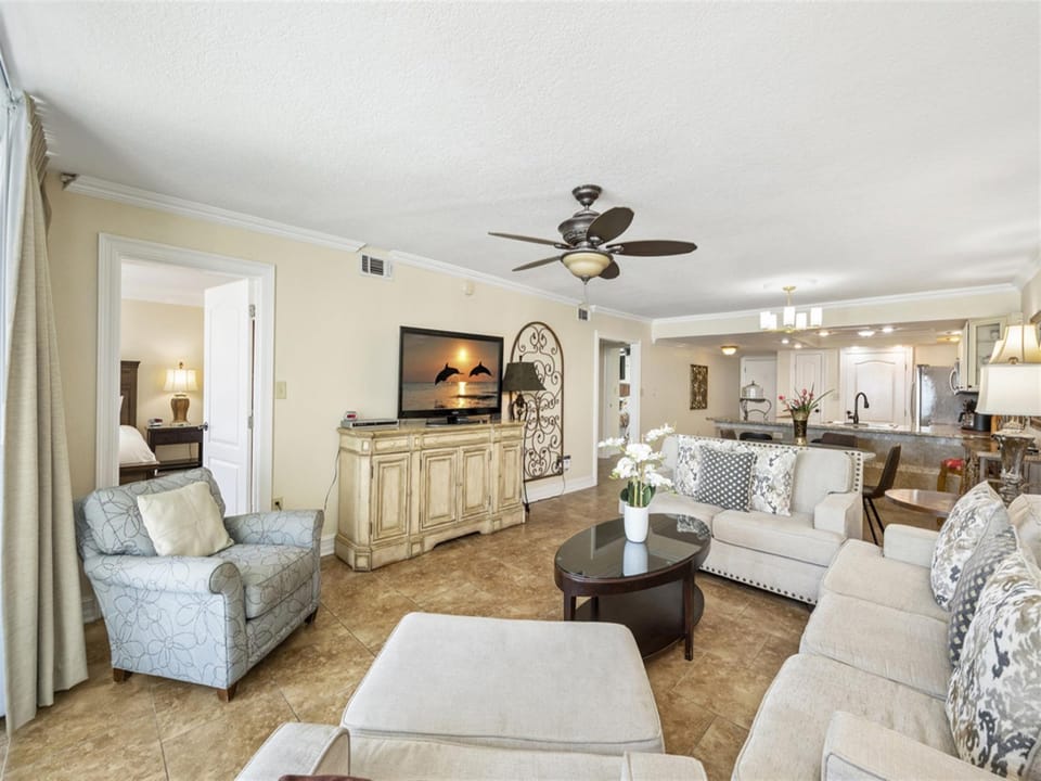 Sink into plush seating while enjoying your favorite shows on the mounted TV, with the open kitchen just steps away for snacks.
