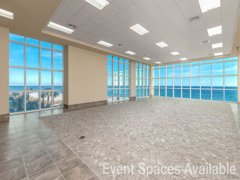 Bright event spaces with large windows offering stunning beach views available, perfect for gatherings and celebrations