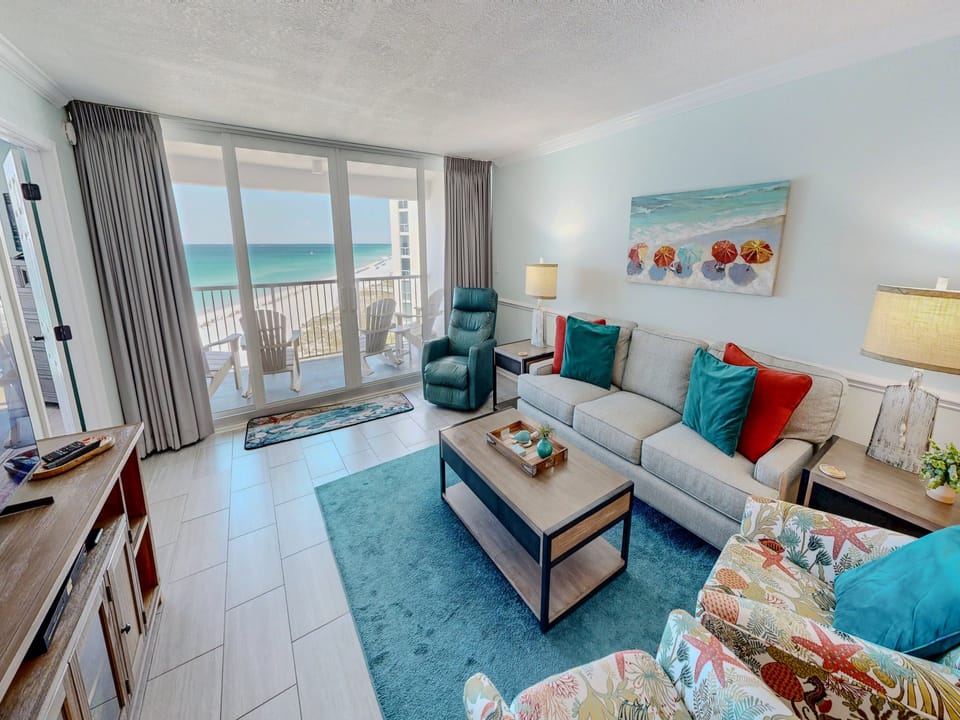 Sink into plush seating while ocean breezes flow through your private balcony doors, creating the perfect beachfront sanctuary.