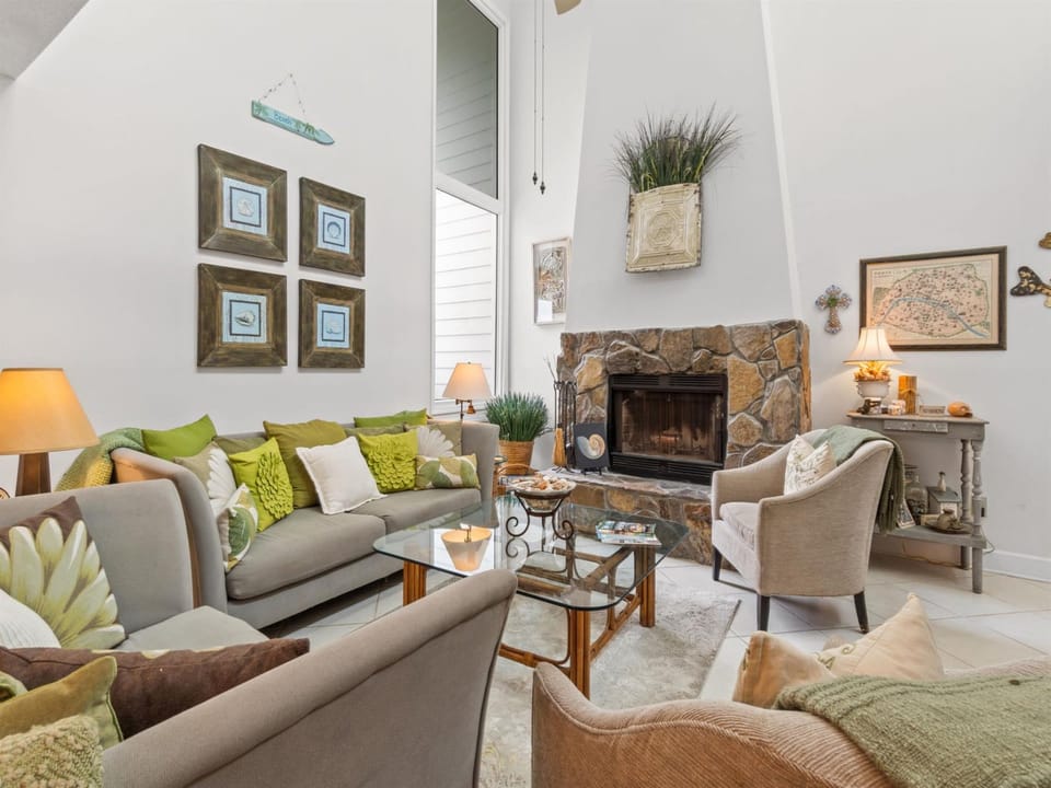 Sink into plush seating by your stone fireplace, where warm light and natural textures create the perfect retreat.