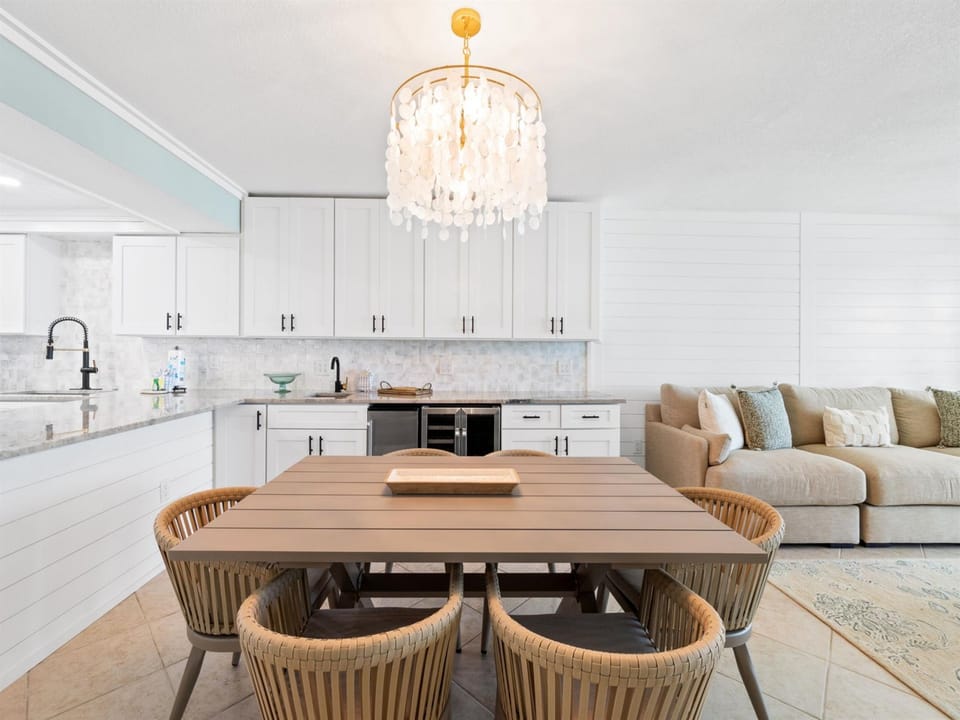 Your stylish dining area flows seamlessly into the modern kitchen, perfect for memorable meals together.