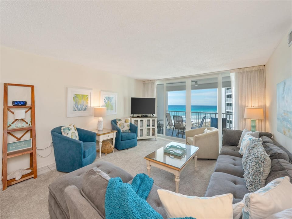 Sink into plush seating while ocean waves fill your view through floor-to-ceiling windows on your private balcony.