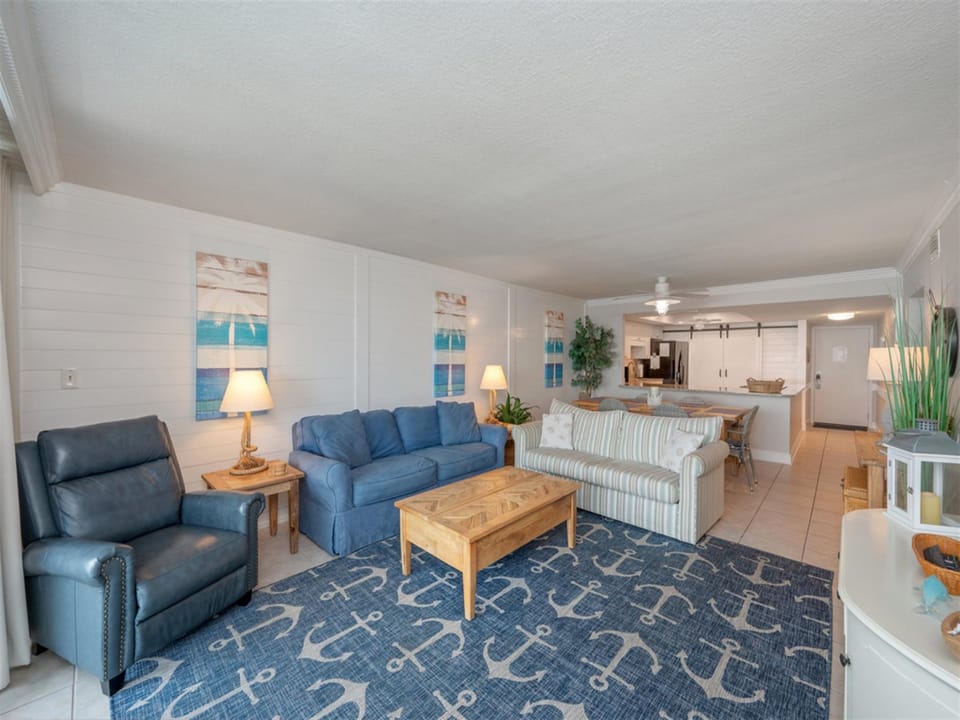 Relax in your coastal-themed living room with plush seating and nautical touches that perfectly capture beachside charm.