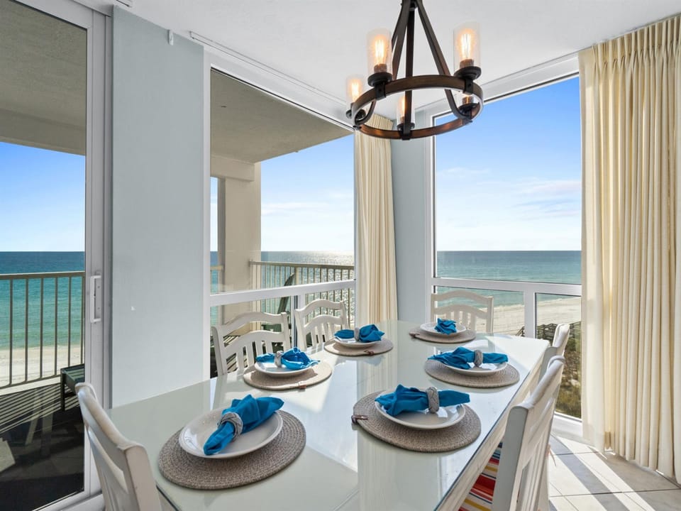 Enjoy memorable meals at your elegant dining table with breathtaking ocean views through floor-to-ceiling windows.
