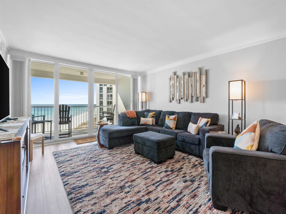 Sink into plush seating while your eyes drink in stunning ocean views through floor-to-ceiling windows. Your perfect retreat awaits.