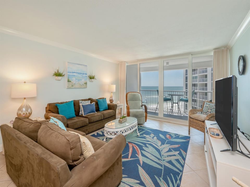 Relax in your coastal living room where ocean views meet comfortable furnishings and beachy décor.