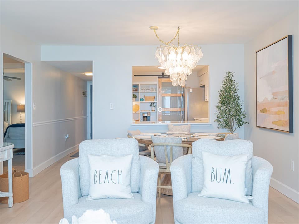 Sink into these dreamy blue chairs where coastal charm meets modern elegance. Your beach getaway begins in this stunning dining space.