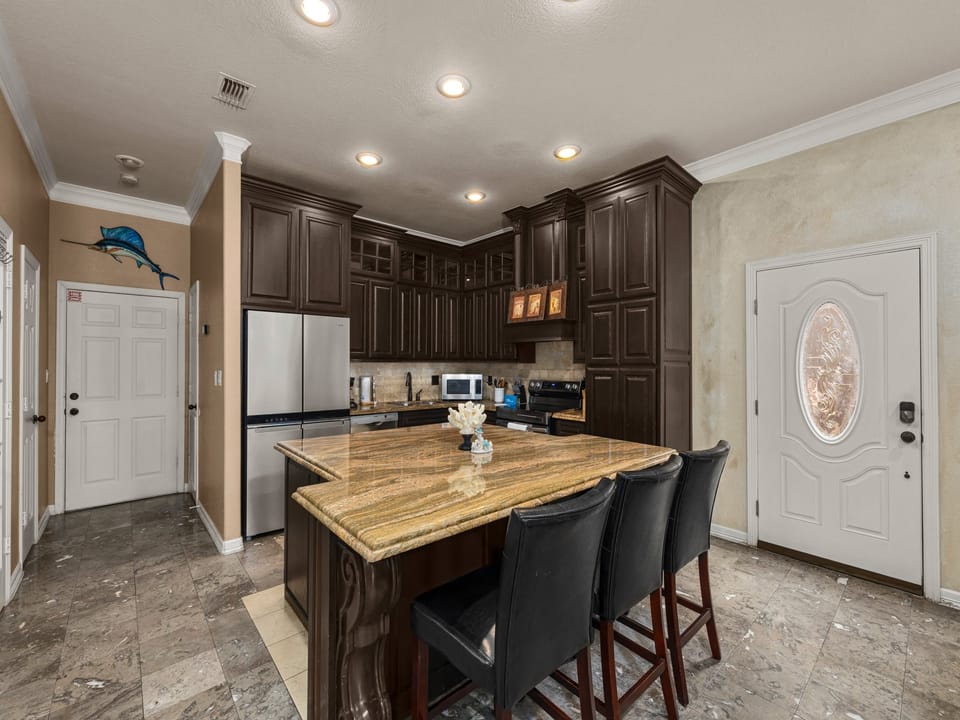 Cook, entertain, and make memories in this beautifully designed kitchen with ample space for everyone to gather.