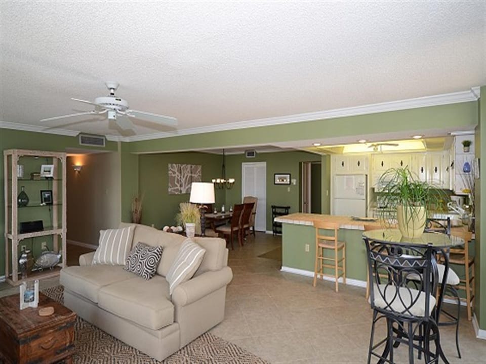 Relax in your spacious open-plan retreat with comfortable seating, fully equipped kitchen, and coastal-inspired decor perfect for unwinding after beach days.