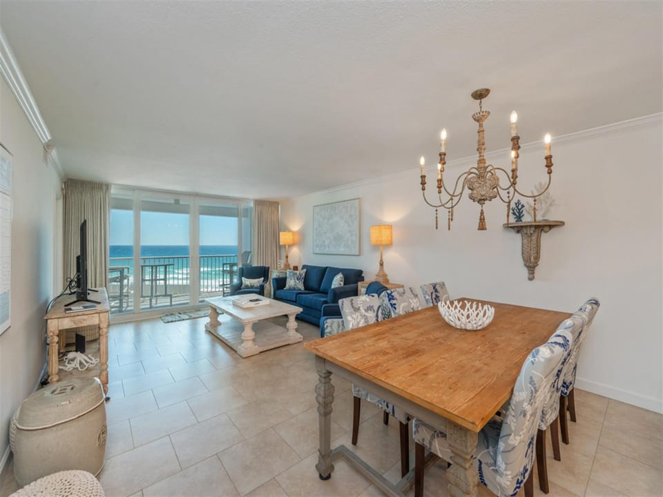 Relax in your elegant oceanfront living space with stunning sea views, comfortable seating, and dining for memorable meals together.