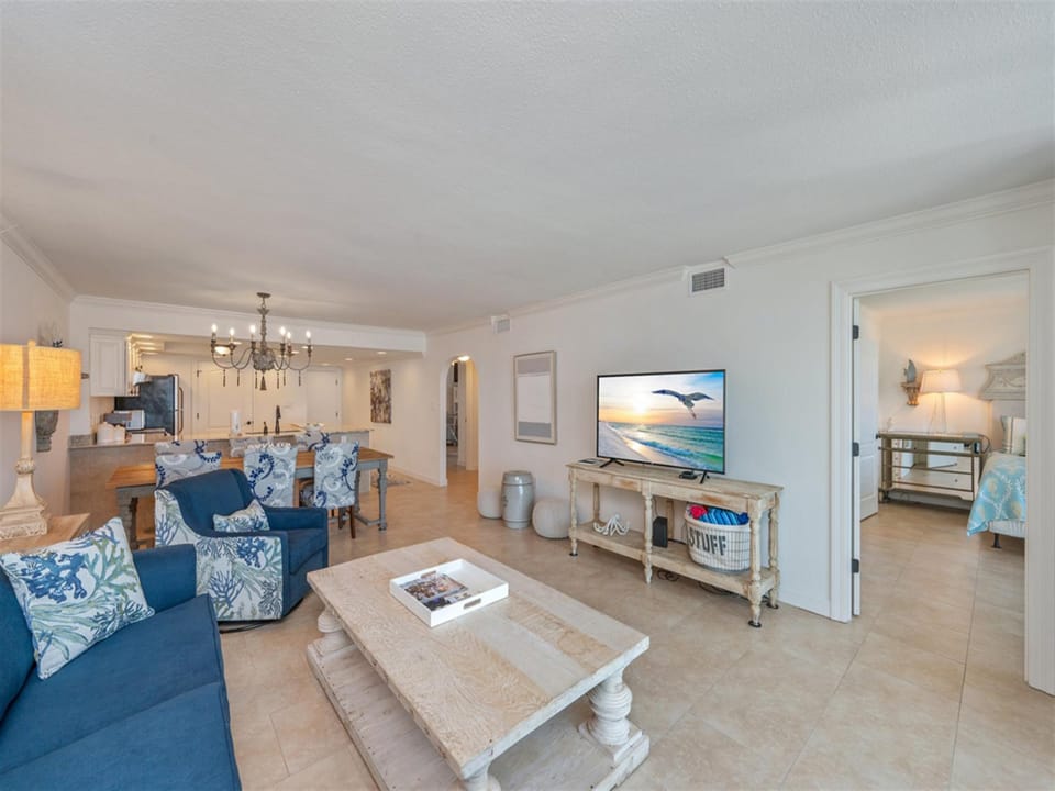 Unwind in this bright, open living space where coastal blues and whites create your perfect beach getaway atmosphere.