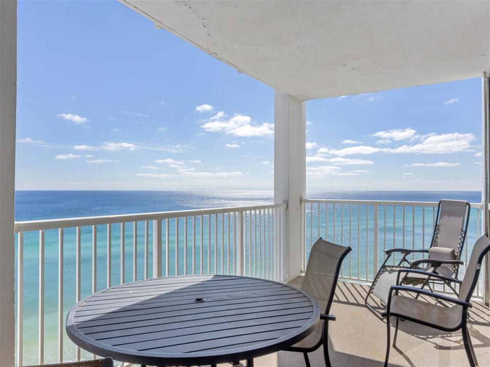 Your private balcony offers stunning ocean views where you can unwind with morning coffee or evening cocktails above turquoise waters.