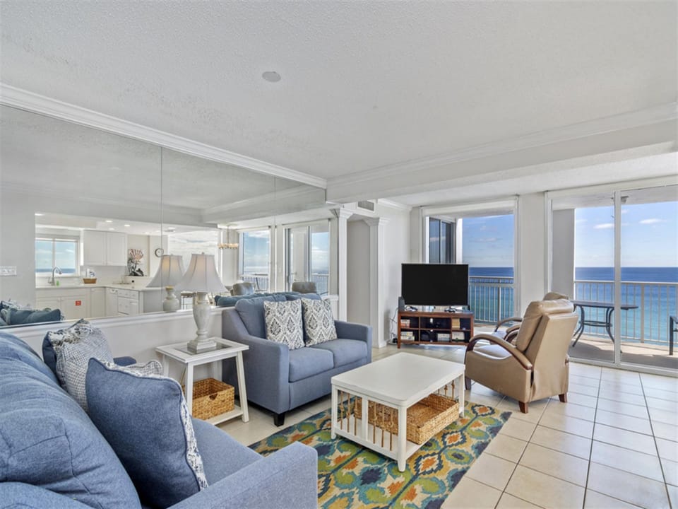 Unwind in your spacious living room where ocean views fill every window and coastal breezes invite relaxation.