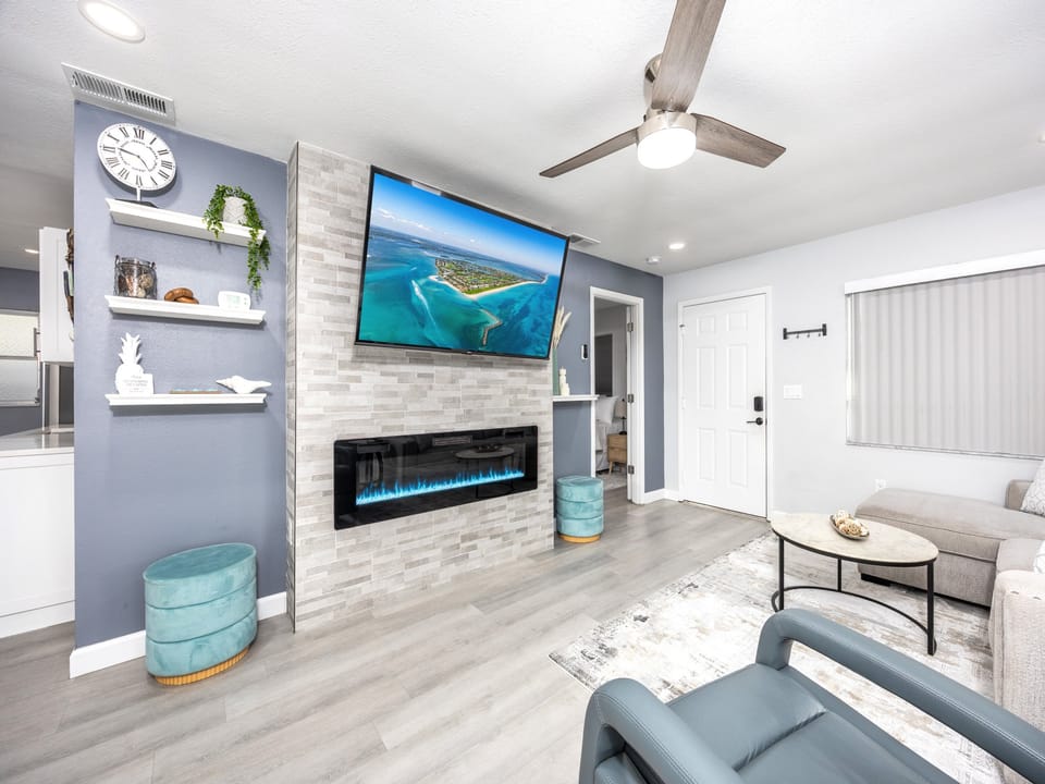 Cozy living room with Smart TV and gas fireplace. Perfect for relaxation after a day at the beach.