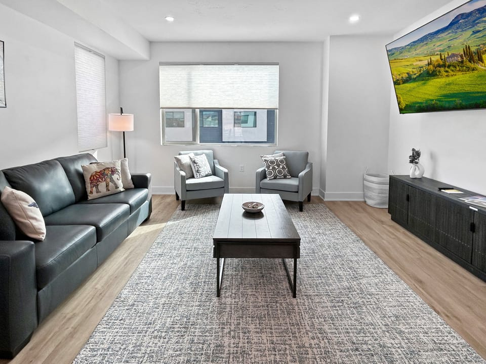 Spacious living room with huge smart tv.