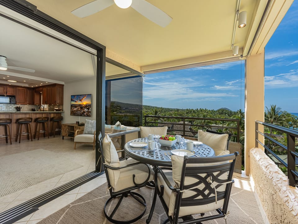 Step onto your private lanai where tropical breezes and panoramic ocean views create the perfect setting for morning coffee or sunset dining.