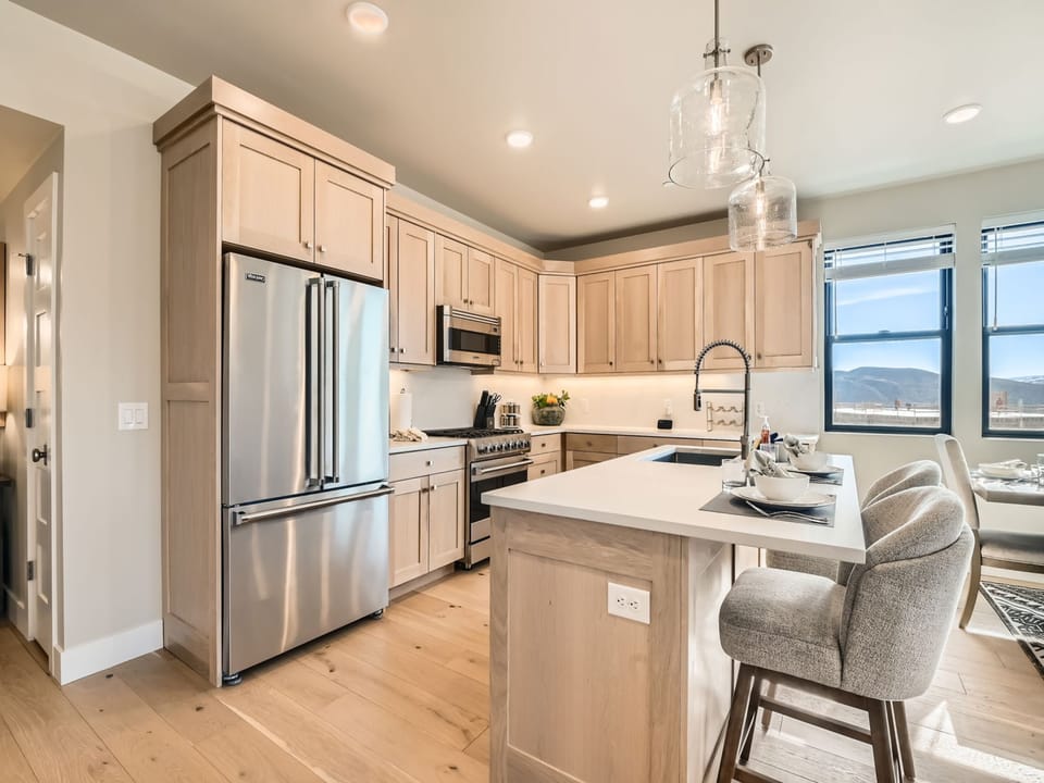Whip up feasts in this gourmet chef's kitchen featuring granite countertops, stainless steel appliances, and a spacious island. Nestled near Deer Valley Resort, it's the perfect mountain retreat.