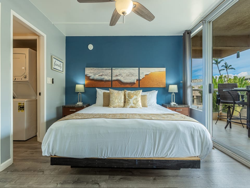 Drift into peaceful sleep in your ocean-inspired bedroom with tropical balcony views and coastal artwork creating the perfect island retreat.
